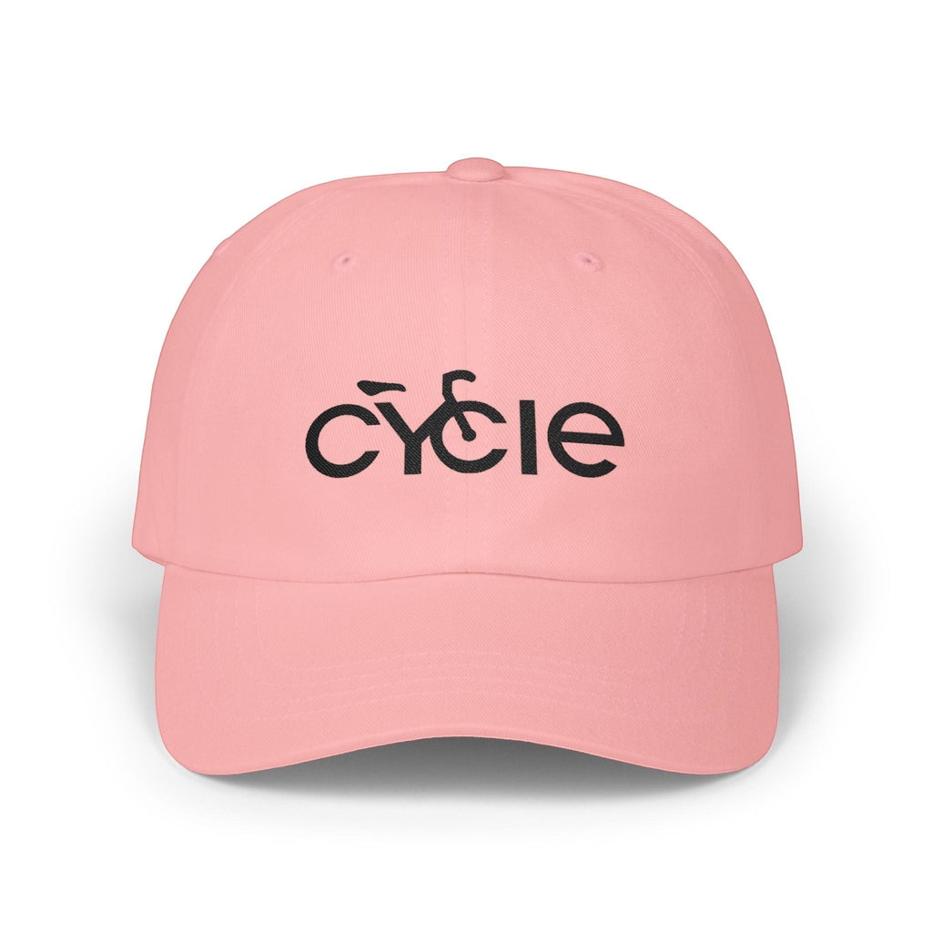 Rack & Cycle pink cotton dad cap with embroidered black 'CYCLE' text and bicycle silhouette. Adjustable strap.