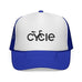 Rack & Cycle blue trucker hat with white front panel featuring a black 'cycle' bike logo. Mesh back and adjustable snap closure.