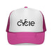 Rack & Cycle pink trucker hat with white front panel featuring a black 'cycle' bike logo. Mesh back for breathability.