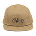 Rack & Cycle tan cotton 5-panel cap with black embroidered "CYCLE" graphic and metal eyelets.