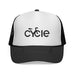 Rack & Cycle trucker hat with white front panel featuring a black 'cycle' bike logo, black mesh back, and black brim. Adjustable snap closure.