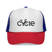 Rack & Cycle trucker hat with white front panel, blue mesh back, and red brim. Features a black 'cycle' logo.